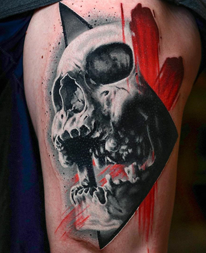 realistic black and grey skull tattoo with red details