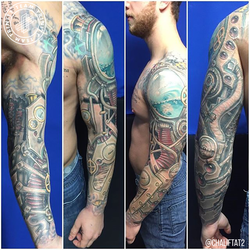 mechanical looking tattoo arm sleeve